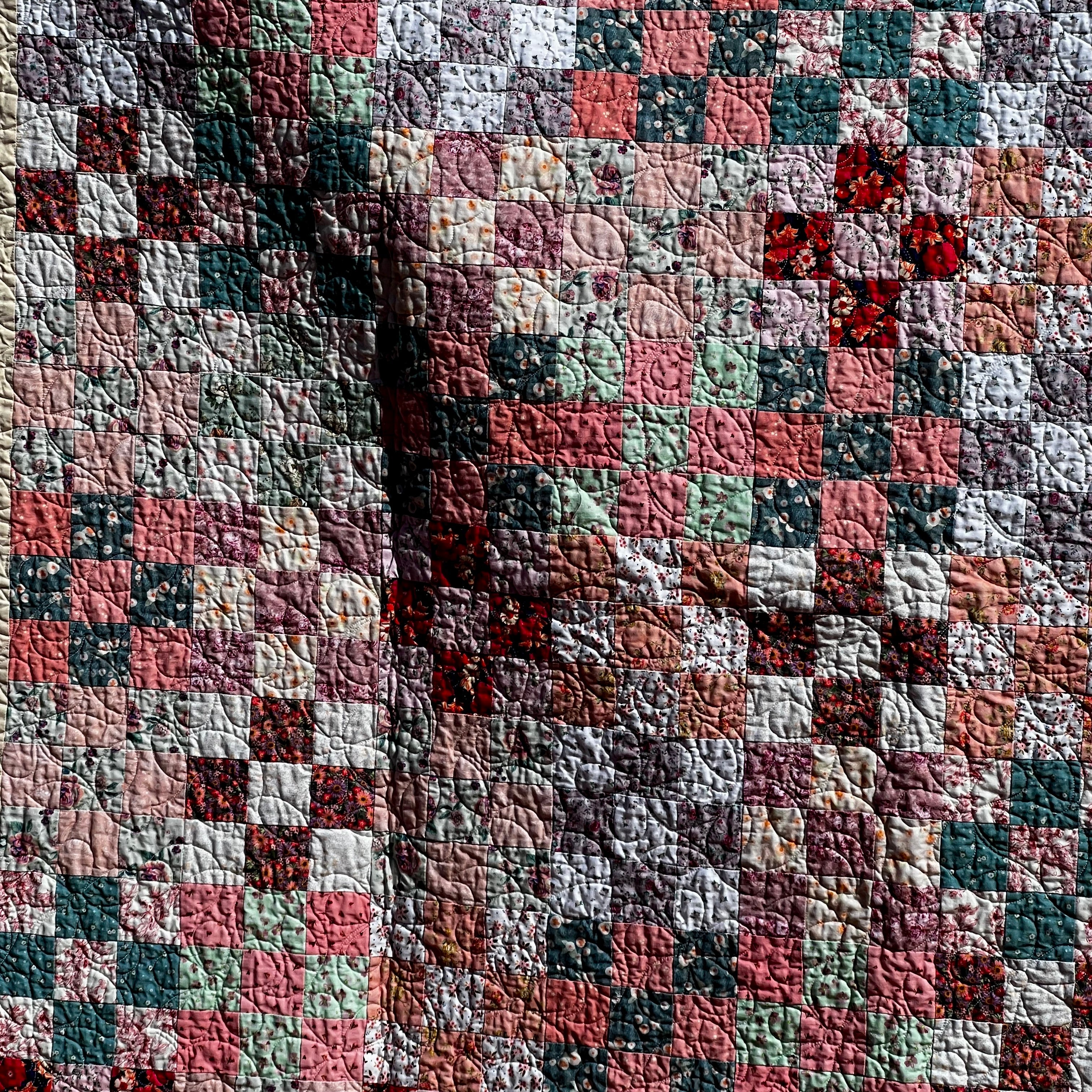 postage stamps - block pattern handmade quilt  - vintage pink tones closeup