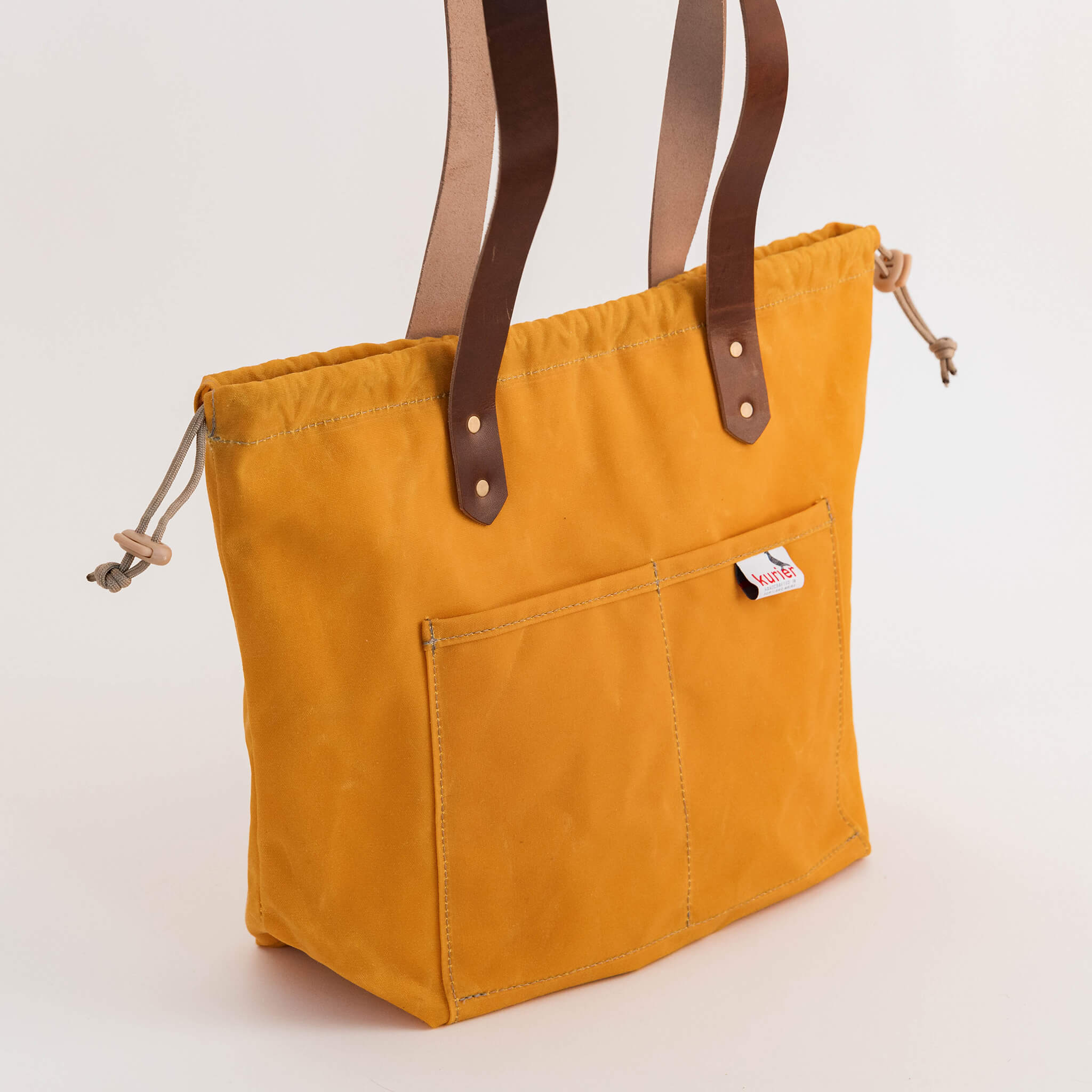 waxed canvas town tote - drawstring travel bag - handmade leather - buttercup side view